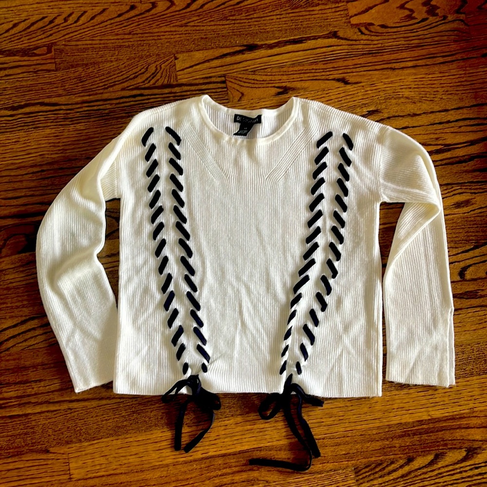 White Design 365 Ladies’ Sweater with black trim. Size XS.